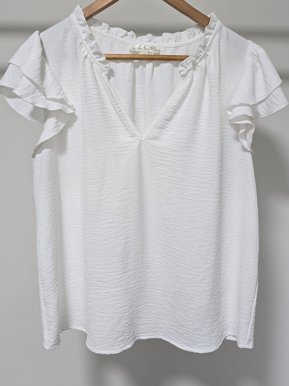 nine britton White V-Neck Ruffle Sleeve Blouse